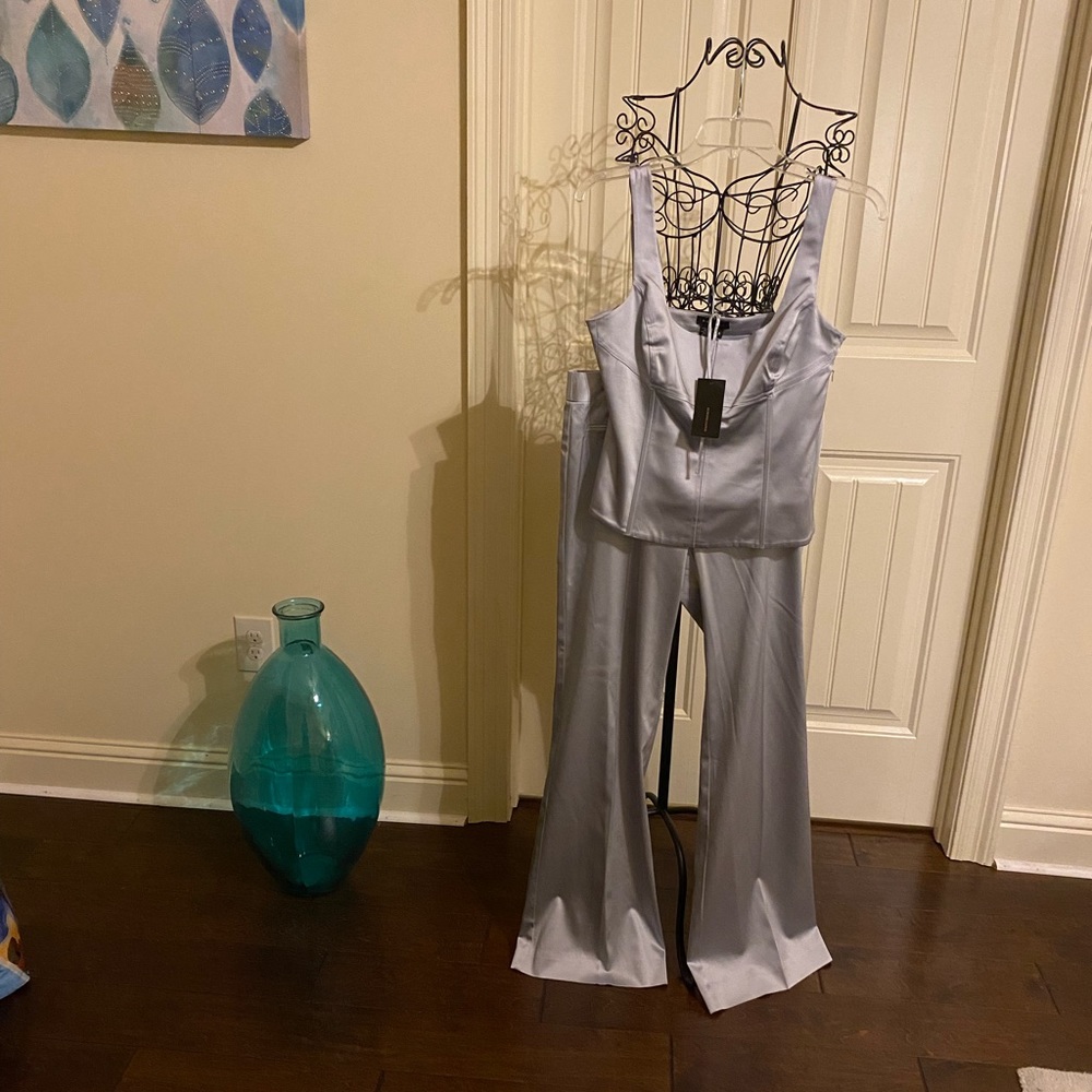 BCBG Max Azria color Is champagne silver.